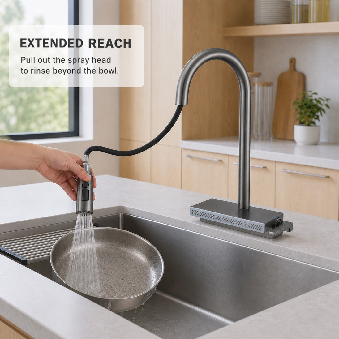 FILER pull-out kitchen faucet rinsing a pan with the extended spray head
