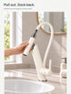 Pull-out spray head and magnetic cradle at a bathroom vanity