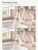 Dense spray and clear stream into a ceramic washbasin, both controls open