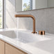 FILER brushed rose gold brass two-hole basin faucet — installed running-water bathroom scene