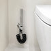 FILER rotary brass bidet sprayer with black coiled hose — installed bathroom scene