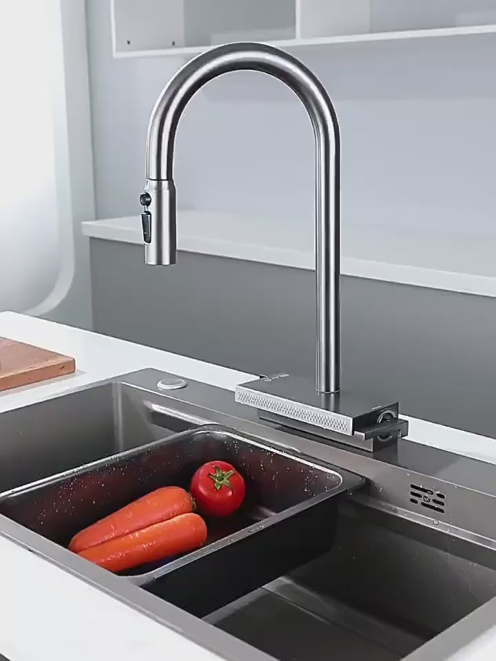 Rain-curtain and pull-out kitchen faucet demonstration; sink shown for context
