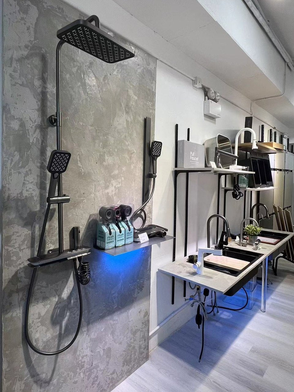 Shower fixtures and sinks displayed in the Hong Kong showroom